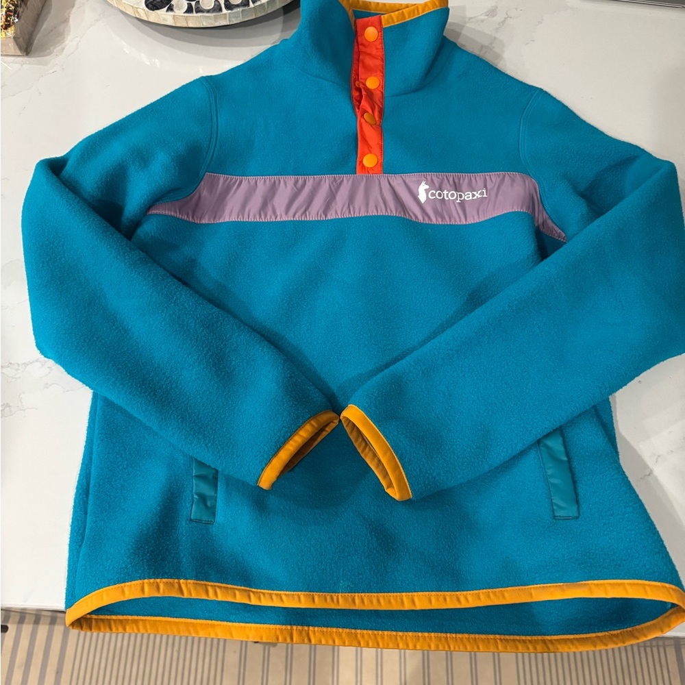 Cotopaxi Teal Fleece Hoodie with Purple and Orange Accents